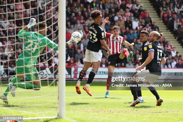 John Egan of Sheffield United has a header saved by Paulo Gazzaniga of Fulham during the Sky Bet Championship match between Sheffield United and...