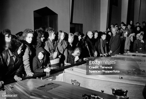 Families and friends viewing coffins of Bloody Sunday victims prior to their funerals at St Mary's Catholic Church in Londonderry during The Troubles...