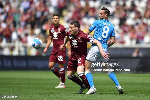 Andrea Belotti of Torino FC competes with Fabian Ruiz of SSC Napoli during the Serie A match between Torino FC and SSC Napoli at Stadio Olimpico di...
