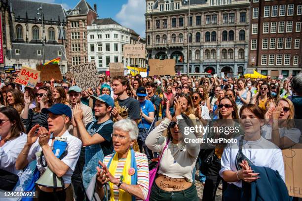 Thousands of people are clapping after a speech pro abortion, during a demonstration in solidarity for the right to abortion in the USA, organized in...