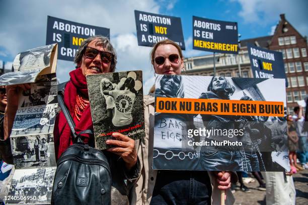 Two women are holding placards that say Boss of my own belly in Dutch, during a demonstration in solidarity for the right to abortion in the USA,...
