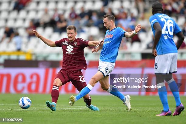 Dennis Praet of Torino FC competes with Fabian Ruiz of SSC Napoli during the Serie A match between Torino FC and SSC Napoli at Stadio Olimpico di...