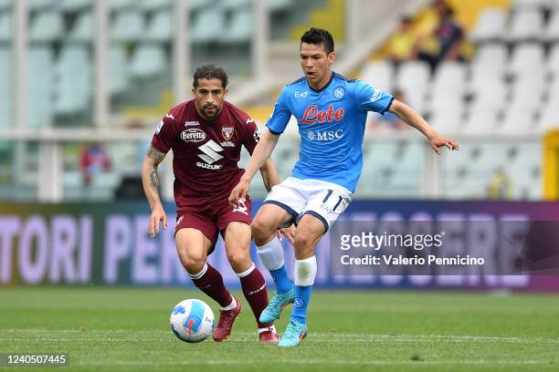 Ricardo Rodriguez of Torino FC competes with Hirving Lozano of SSC Napoli during the Serie A match between Torino FC and SSC Napoli at Stadio...