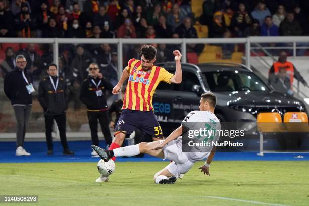 Captain Fabio Lucioni (US Lecce) raises the cup to the sky for the