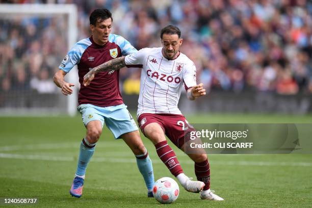 Aston Villa's English striker Danny Ings vies with Burnley's English midfielder Jack Cork during the English Premier League football match between...