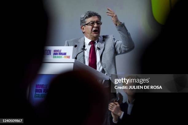 French leftist movement La France Insoumise's leader and three times presidential candidate Jean-Luc Melenchon gestures as he delivers a speech...