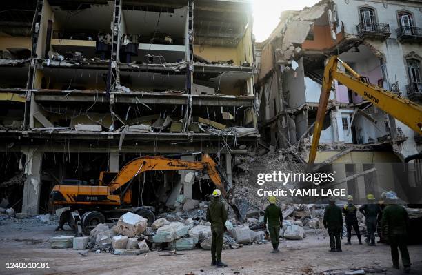 Rescuers remove debris from the ruins of the Saratoga Hotel, in Havana, on May 7, 2022. - The death toll after an explosion ripped through a luxury...