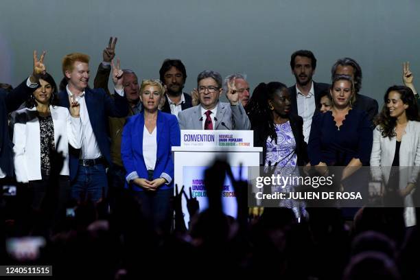 French leftist movement La France Insoumise's leader and three times presidential candidate Jean-Luc Melenchon flashes the V-sign after delivering a...