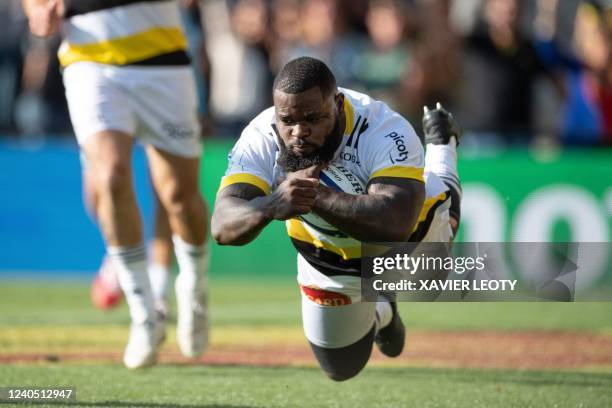 La Rochelle's French prop Dany Priso runs with the ball and scores a try during the European Rugby Champions Cup round of 8 rugby union match between...