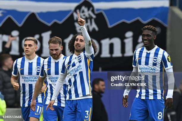 Brighton's Spanish defender Marc Cucurella celebrates with teammates after scoring their second goal during the English Premier League football match...