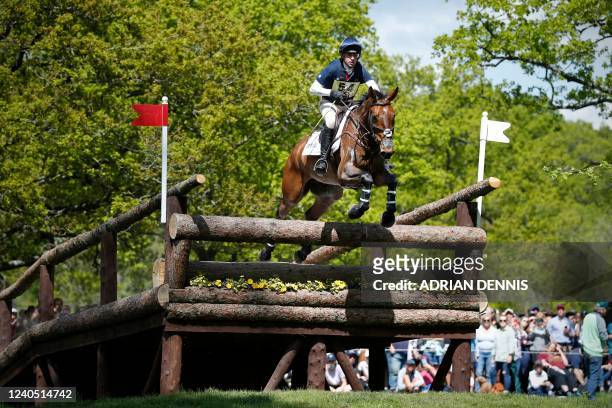 Britain's James Rushbrooke riding Milchem Eclipse jumps the Ford Broken Bridge fence during the cross-country test of the Badminton Horse Trials in...