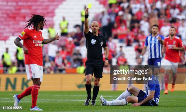 Referee Luis Godinho shows a yellow card to Valentino Lazaro of SL Benfica during the Liga Bwin match between SL Benfica and FC Porto at Estadio da...