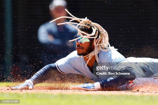 Raimel Tapia of the Toronto Blue Jays scores on a double by George Springer during the second inning of game one of a doubleheader against the...