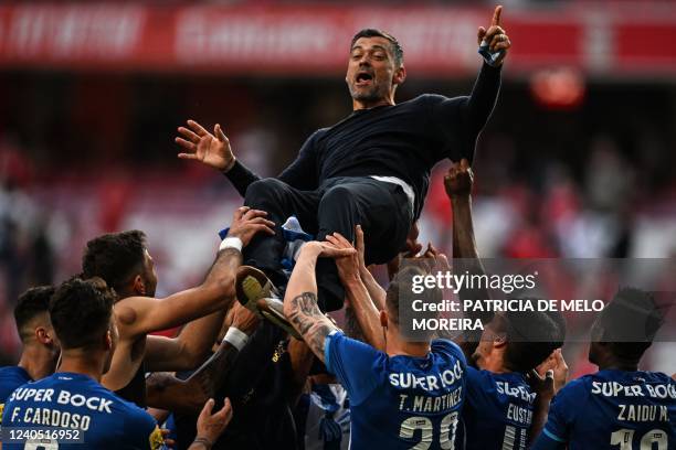 Porto's Portuguese coach Sergio Conceicao celebrates with his players after Porto won the Portuguese League football between SL Benfica and FC Porto...