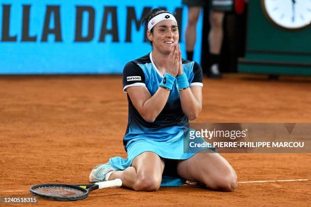 Tunisia's Ons Jabeur celebrates after winning against US Jessica Pegula during their 2022 WTA Tour Madrid Open tennis tournament women's singles...