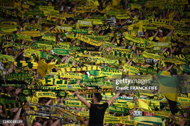 Nantes' supporters cheer in the stands during the French Cup final football match between OGC Nice and FC Nantes at the Stade de France, in...