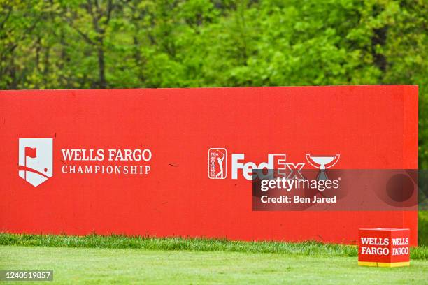 Wells Fargo Championship and FedEx Cup signage is seen on a tee box sign during the third round of the Wells Fargo Championship at TPC Potomac at...