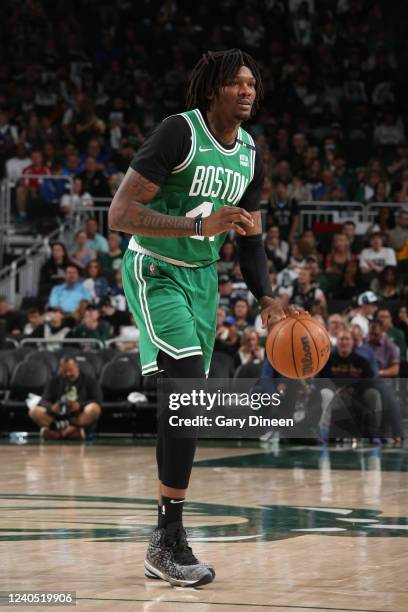 Robert Williams III of the Boston Celtics dribbles the ball during Game 3 of the 2022 NBA Playoffs Eastern Conference Semifinals against the...