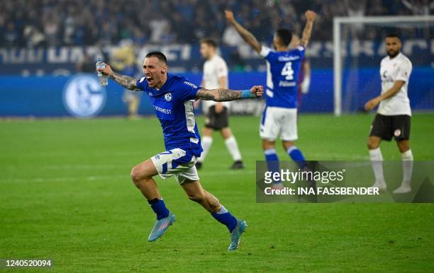 Schalke's Macedonian winger Darko Churlinov celebrates on the pitch after the German second division Bundesliga football match between FC Schalke 04...