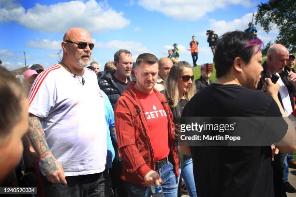 Tommy Robinson and the survivor of child sexual abuse Sarah Rushton walk hand in hand to the screening on May 7, 2022 in Telford, England. After...