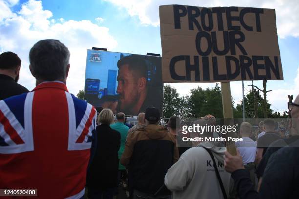 Supporters of Tommy Robinson and his child grooming documentaries attend the screening on May 7, 2022 in Telford, England. After marching to the city...
