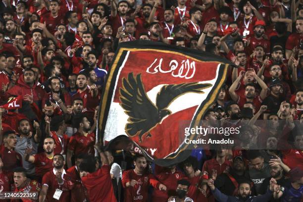 Fans of Al Ahly cheer at tribune during CAF Champions League semi-final match between Al Ahly and Es Setif at Al-Salam Stadium in Cairo, Egypt on May...