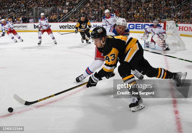 Danton Heinen of the Pittsburgh Penguins handles the puck against the New York Rangers in Game Three of the First Round of the 2022 Stanley Cup...