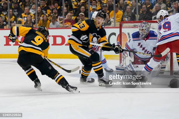 Pittsburgh Penguins center Evan Rodrigues scores a goal past New York Rangers goaltender Igor Shesterkin during the first period in Game Three of the...