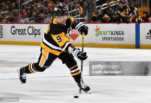 Evan Rodrigues of the Pittsburgh Penguins takes a shot against the New York Rangers in Game Three of the First Round of the 2022 Stanley Cup Playoffs...