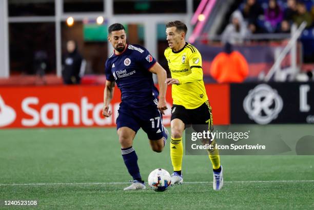 New England Revolution midfielder Sebastian Lletget tries to catch Columbus Crew midfielder Pedro Santos during a match between the New England...