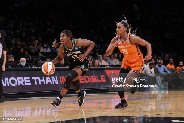 Michaela Onyenwere of the New York Liberty drives to the basket during the game against the Connecticut Sun on May 7, 2022 at Barclays Center in...