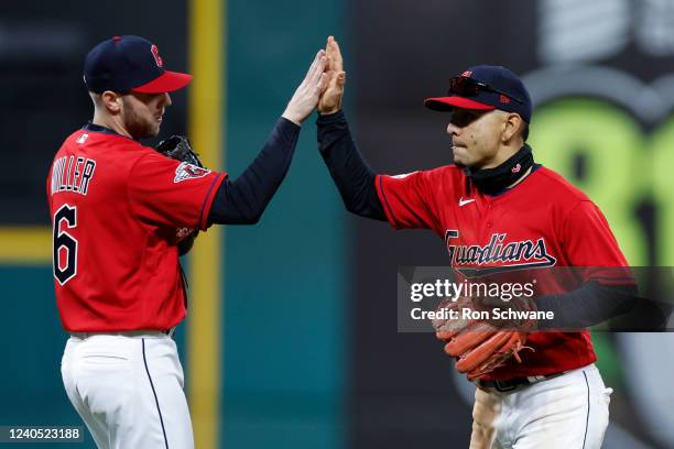 Owen Miller and Andres Gimenez of the Cleveland Guardians celebrate an 8-2 win against the Toronto Blue Jays in game two of a doubleheader at...