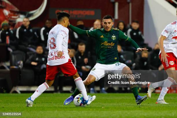 Portland Timbers midfielder Cristhian Paredes defends New York Red Bulls midfielder Frankie Amaya during the first half of the Major League Soccer...