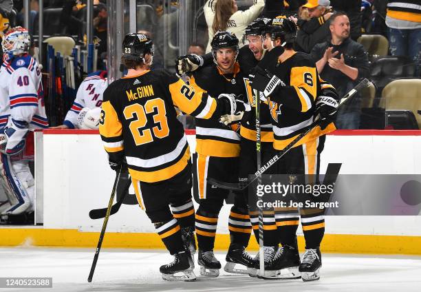 Jeff Carter of the Pittsburgh Penguins celebrates his goal with teammates during the third period against the New York Rangers in Game Three of the...