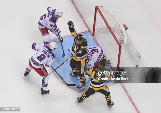 Jeff Carter of the Pittsburgh Penguins reacts after scoring a goal past Igor Shesterkin of the New York Rangers during the first period in Game Three...