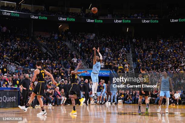 Ja Morant of the Memphis Grizzlies shoots a buzzer beater half court basket at halftime against the Golden State Warriors during Game 3 of the 2022...