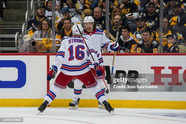 New York Rangers left wing Artemi Panarin celebrates with New York Rangers center Ryan Strome after scoring a goal during the second period in Game...