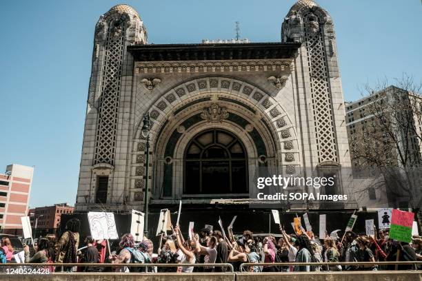 Protesters hold placards, chant, and march through downtown Detroit in support of Roe v Wade. Pro-choice activists march through the streets of...