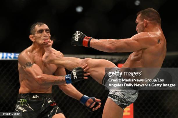 Michael Chandler lands a kick to the head of Tony Ferguson knocking him out during their lightweight bout during UFC 274 at Footprint Center in...