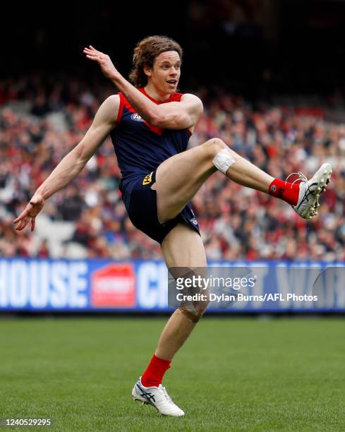 Ben Brown of the Demons kicks the ball during the 2022 AFL Round 08 match between the Melbourne Demons and the St Kilda Saints at the Melbourne...