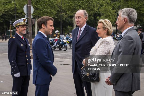 France's President Emmanuel Macron speaks with Yves de Gaulle , a grand-son of Charles de Gaulle, his wife Laurence de Gaulle and Herve Gaymard ,...