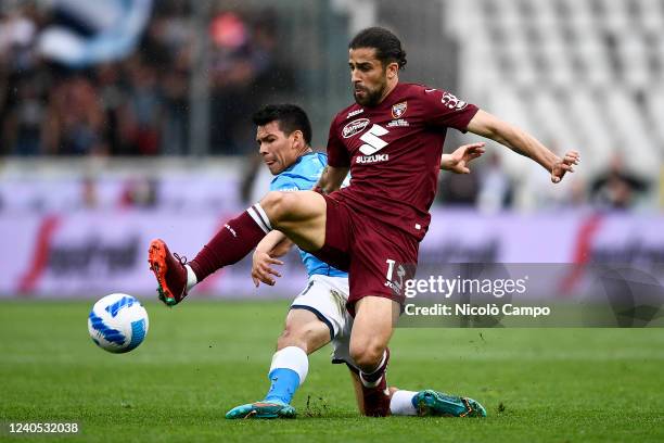 Ricardo Rodriguez of Torino FC competes for the ball with Hirving Lozano of SSC Napoli during the Serie A football match between Torino FC and SSC...