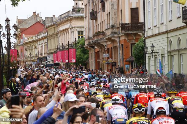 Spectators cheer as riders take the start of the third stage of the Giro d'Italia 2022 cycling race, 201 kilometers between Kaposvar and...