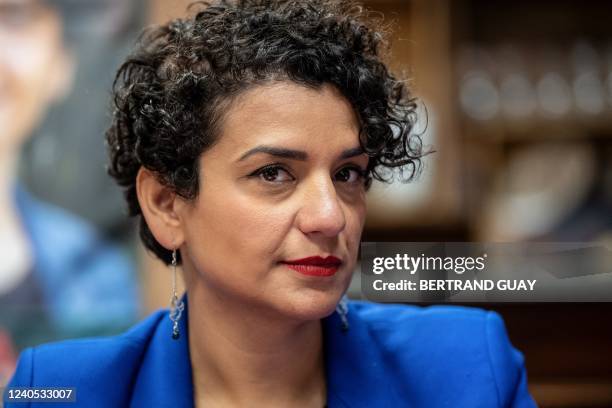 French Socialist Party MP Lamia el-Aaraje speak to the press after visiting a Sunday market with a French former prime minister as part of the June...