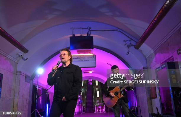 Bono , Irish singer-songwriter, activist, and the lead vocalist of the rock band U2, and guitarist David Howell Evans aka 'The Edge', perform at...