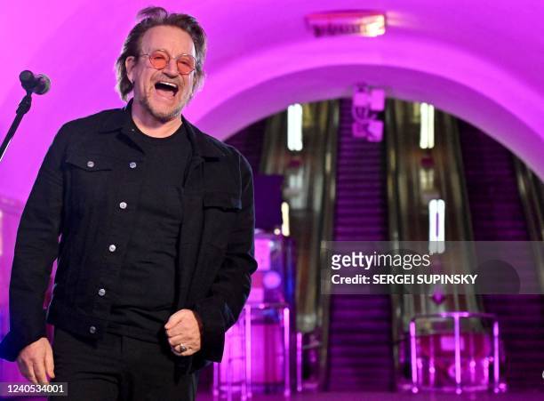 Bono , Irish singer-songwriter, activist, and the lead vocalist of the rock band U2, performs at subway station which is bomb shelter, in the center...