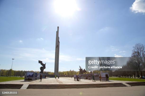 May 2022, Latvia, Riga: Photo panels of the war photo exhibition in front of the Victory Monument. An exhibition of war photos from Ukraine has been...