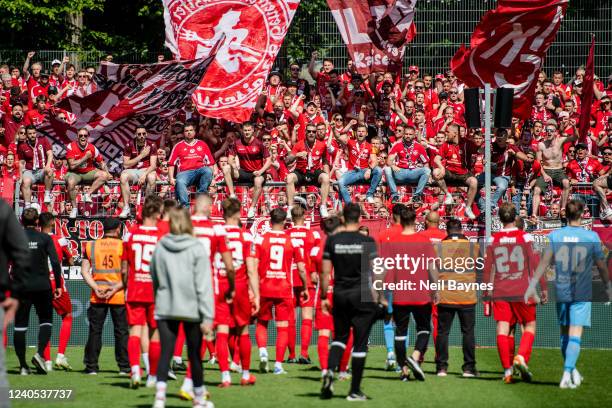 Kaiserslautern fans acknowledge their team after a 2-0 defeat at the end of the 3. Liga match between Viktoria Koeln and 1. FC Kaiserslautern at...