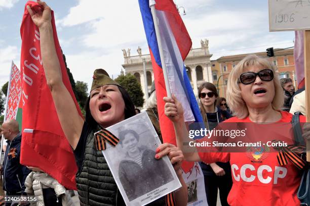 People gather in Piazza San Giovanni to celebrate the Immortal Regiment on the anniversary of the Soviet victory over Nazi Germany with photos of the...
