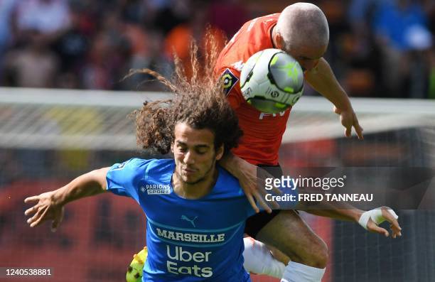 Lorient's French midfielder Fabien Lemoine fights for the ball with Marseille's French midfielder Matteo Guendouzi during the French L1 football...